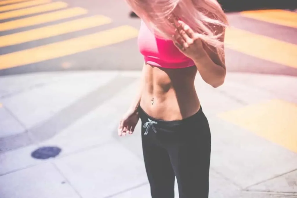Woman with toned stomach after LA-EMS Body Sculpting Treatment Bournville
